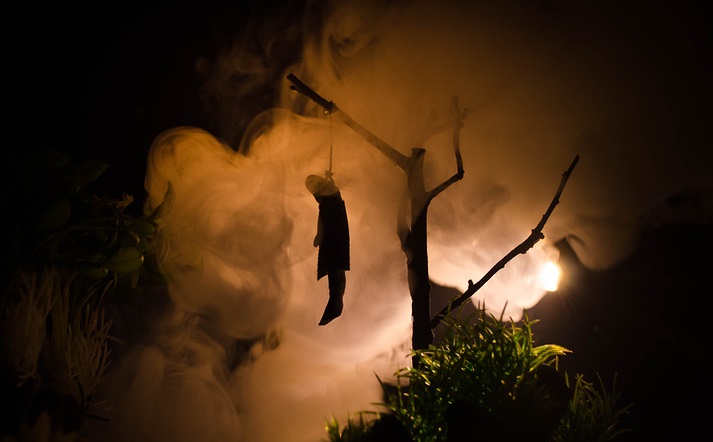 Horror view of hanged girl on tree at evening (at night) Suicide decoration. Death punishment executions or suicide abstract idea. Different background decoration