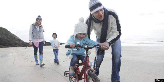 Family on beach in winter